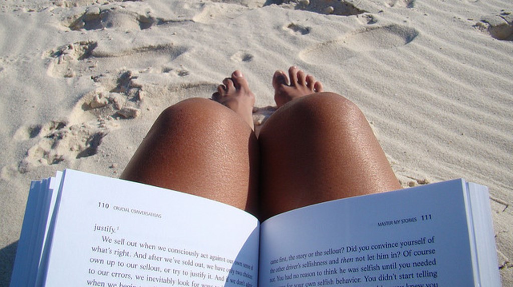 Reading on beach by Aaformaa via Flickr