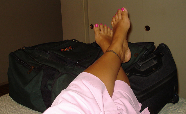 Feet on Suitcase by eyesogreen via Flickr