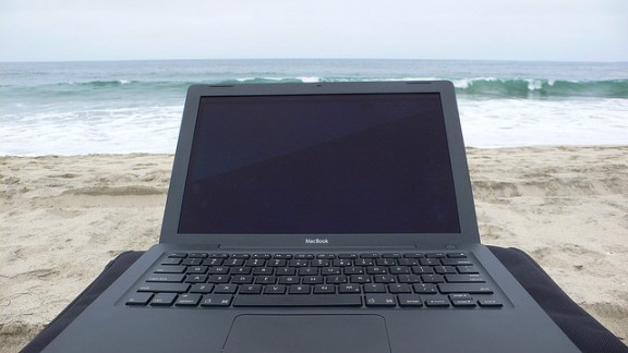 Laptop on beach by End User via Flickr